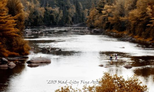 Two fishermen in the autumn landscape of the northwoods of Wisconsin, in Vilas county.